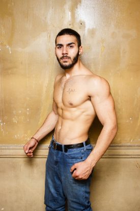 Portrait of refugee Mohamad without his shirt