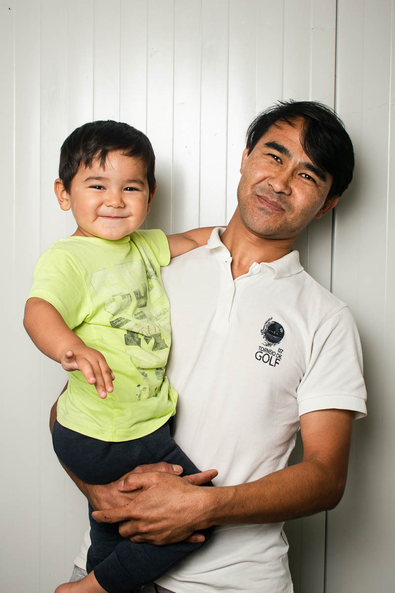 Portrait of refugee Mohamadali with his son