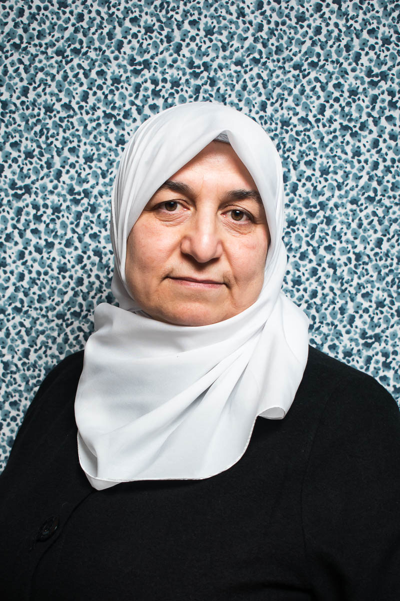 Portrait of refugee G wearing a white hijab