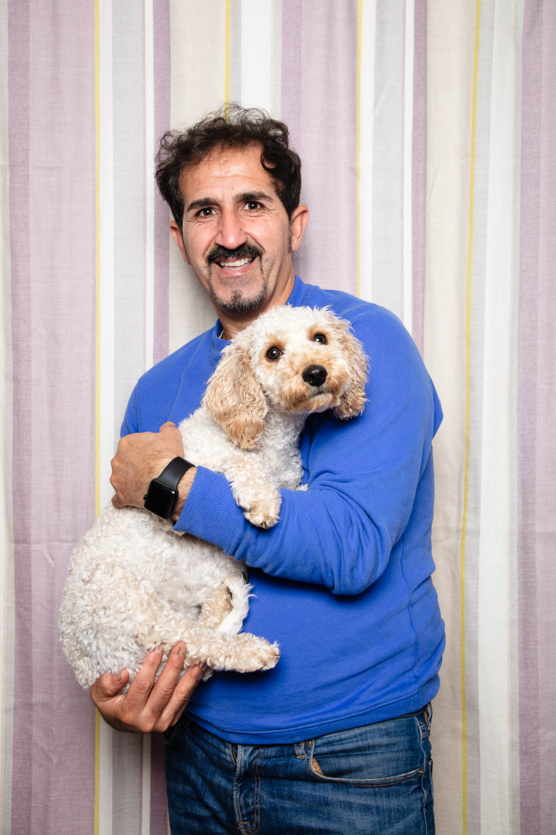 Portrait of refugee Salah holding his dog