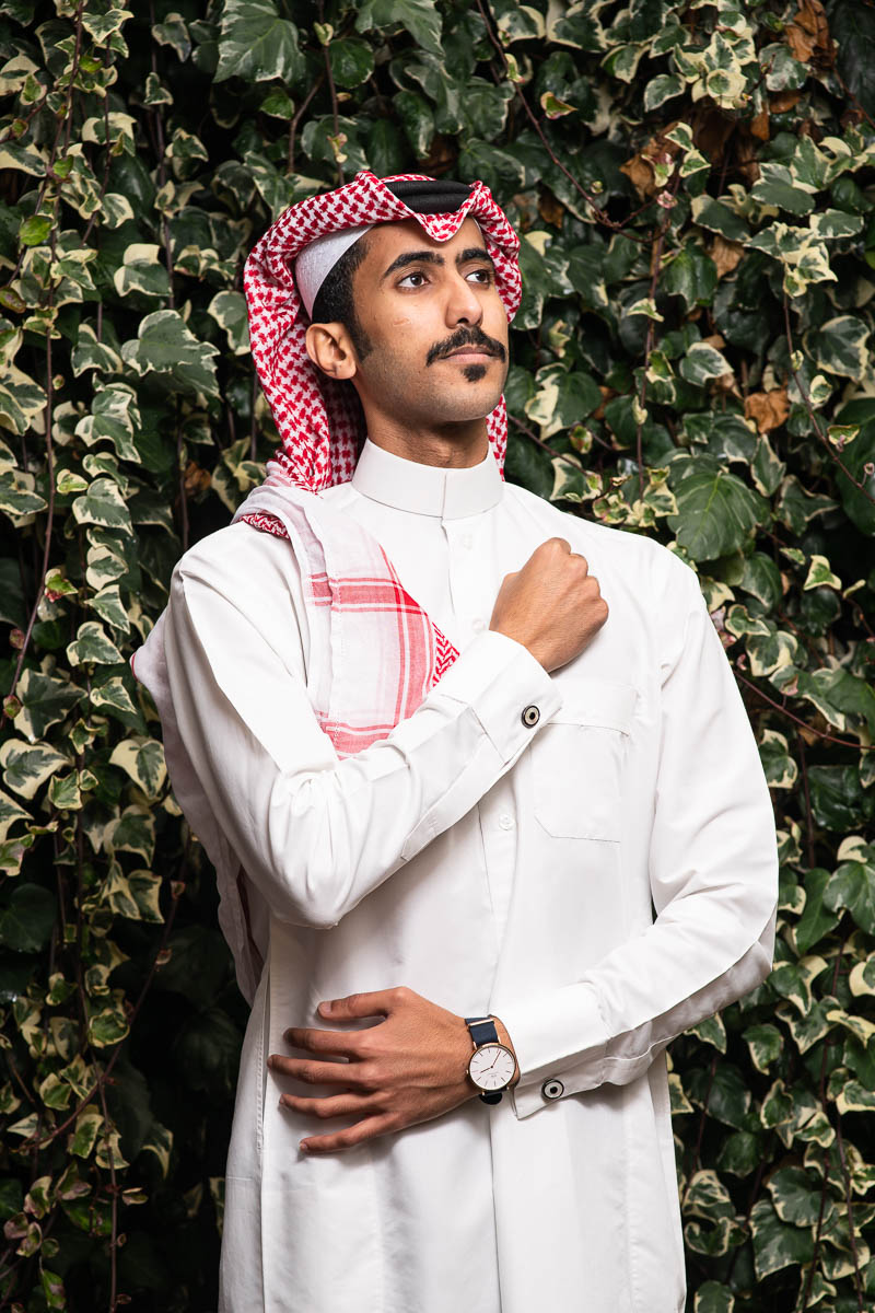 Portrait of refugee Abdullah wearing the tradition arab white kandoora with the keffiyeh head piece