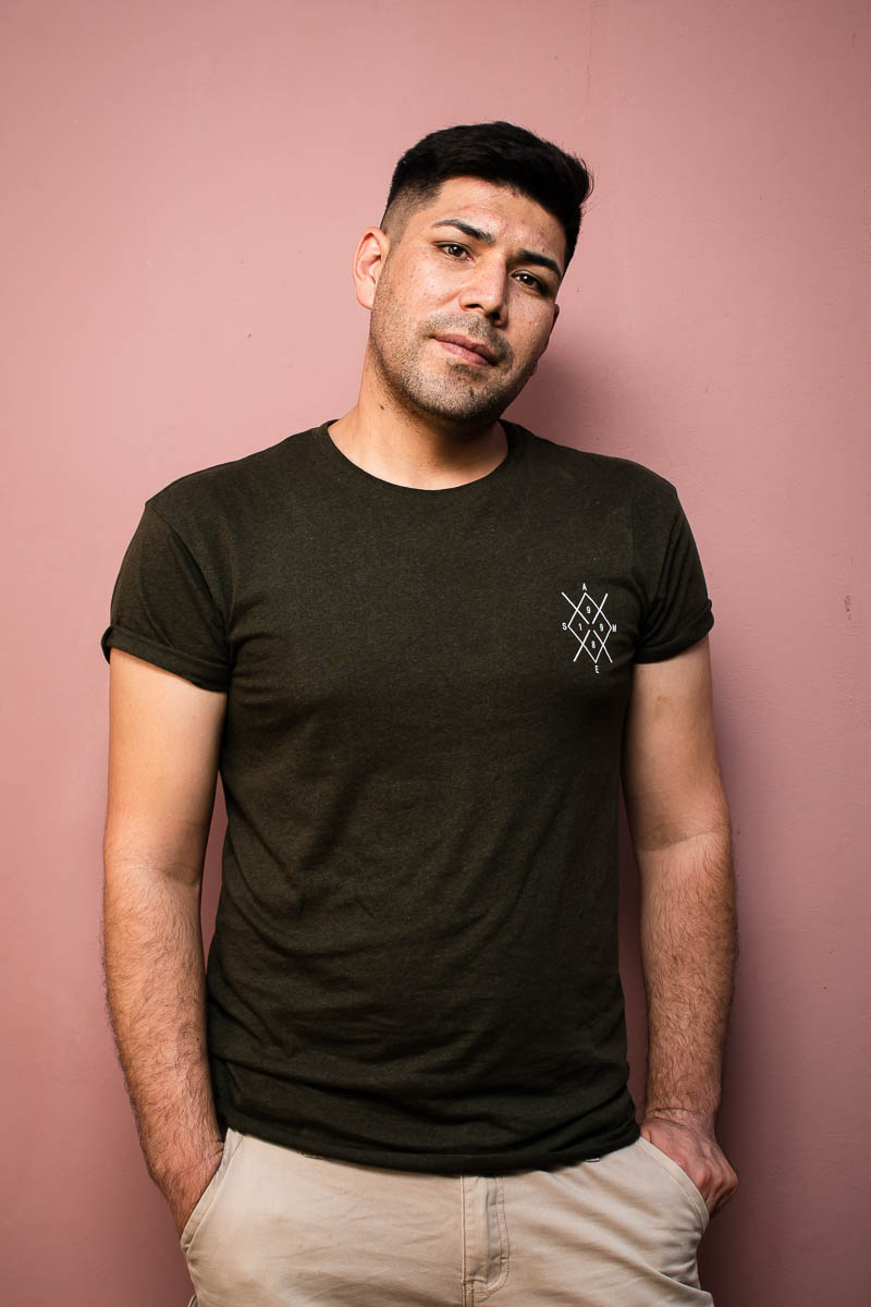 Portrait of refugee Mohammad with his hands in his pockets