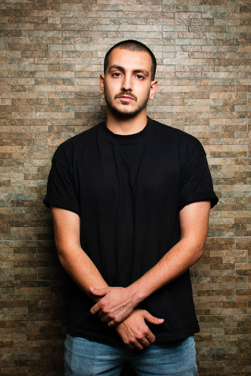 Portait of Muhammad Nur, facing neutral in the camera wearing black shirt.