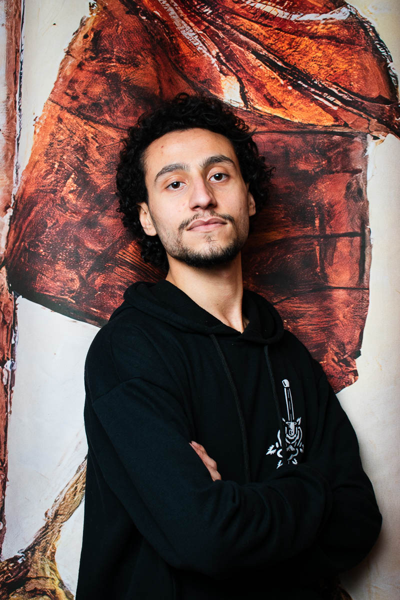 Portrait of Rafi, facing neutral into the camera and is wearing a black jacket.