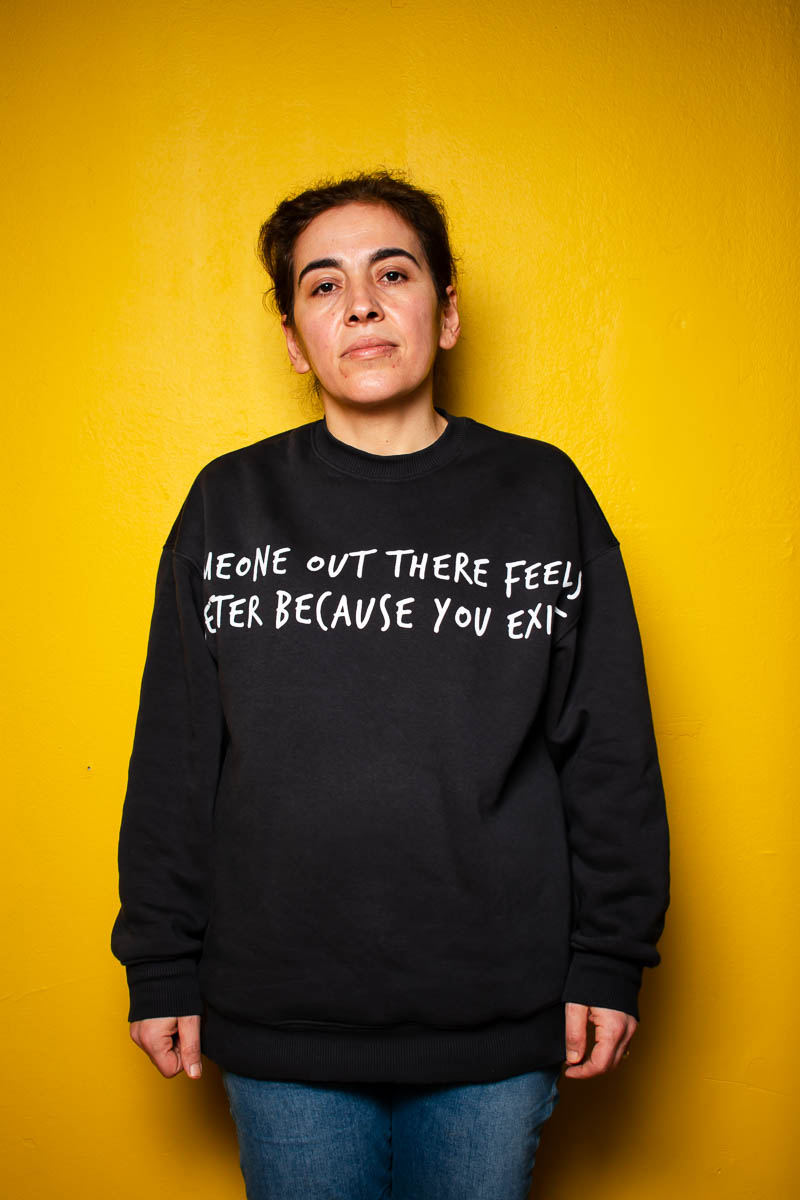 Portrait of Zeynep, facing neutral towards the camera and is wearing a black jacket with label on it.
