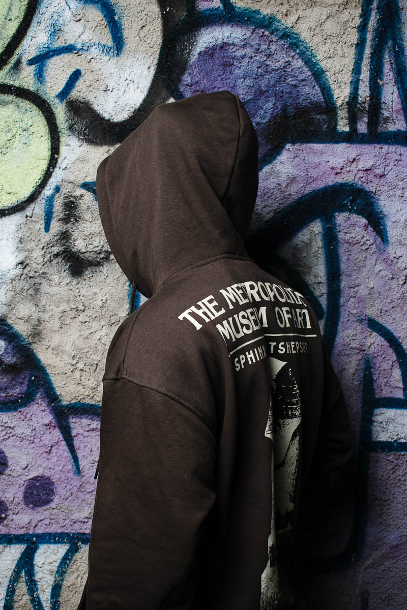 Portrait of Hanger, turning his back at the camera and is wearing a black jacket.