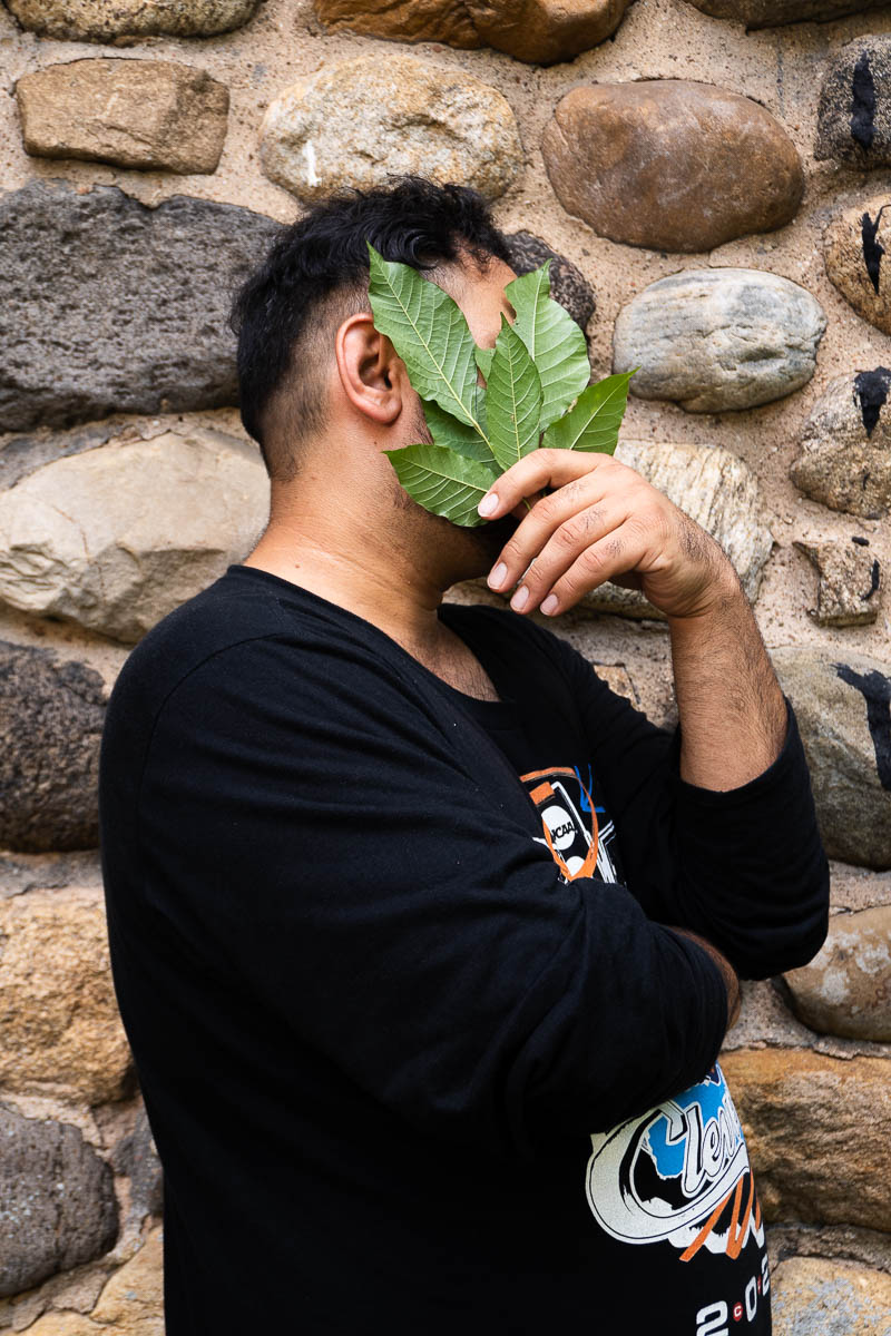 Portrait of Baba, not showing his face to the camera and is wearing a black long sleeves.