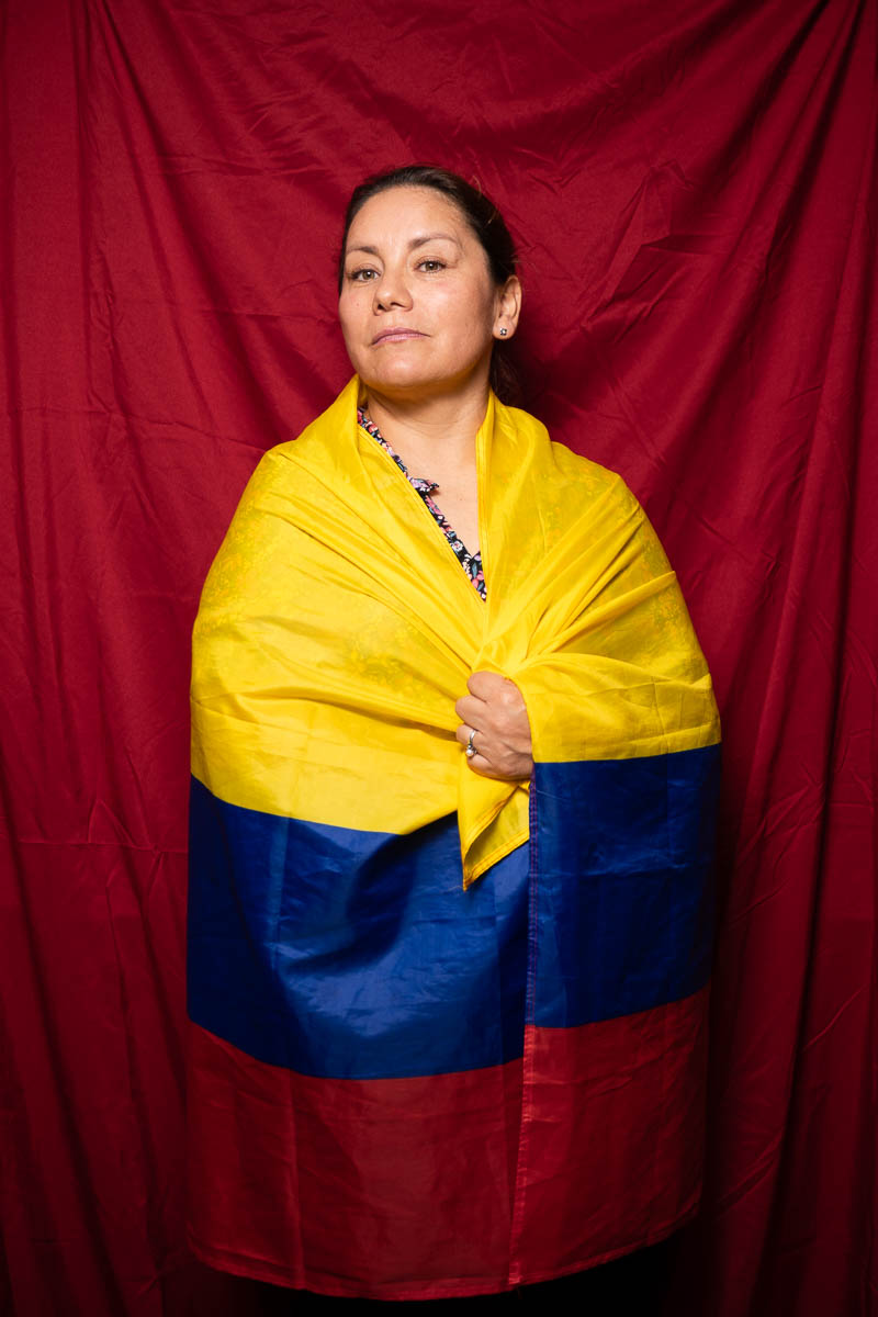 Portrait of Juanita, wrapped herself with a Columbia flag.