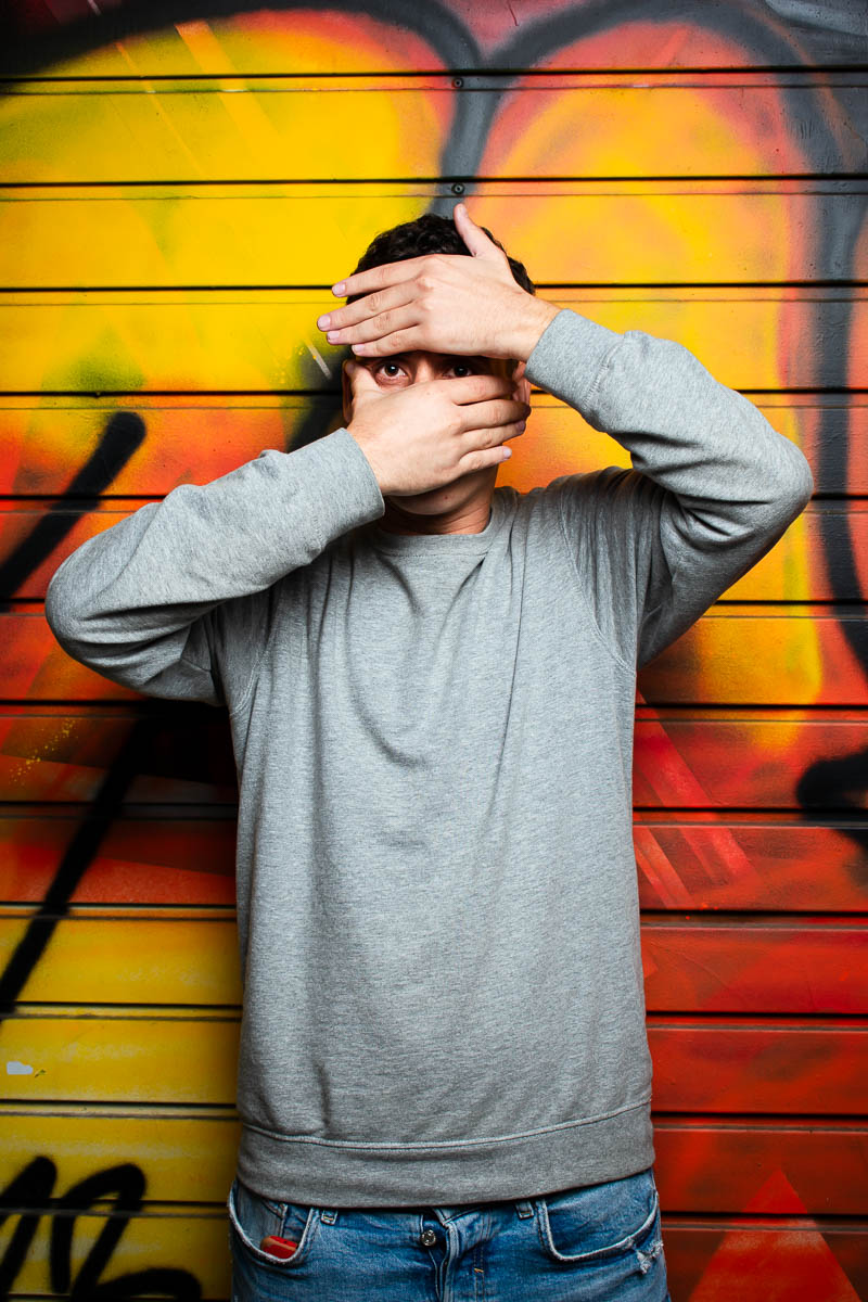 Portrait of Saber covered his face with his hands and is wearing a gray long sleeves.